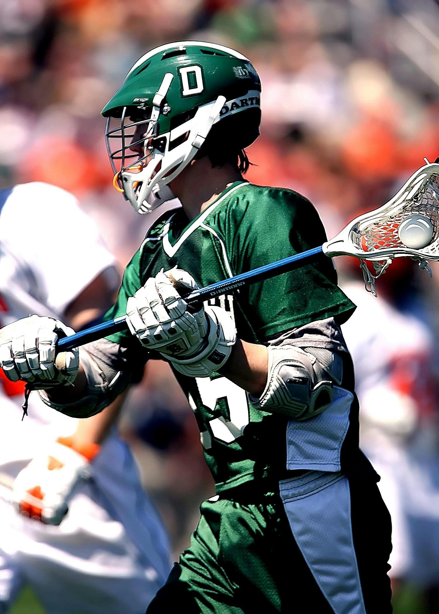 Lacrosse player getting ready to shoot a ball.