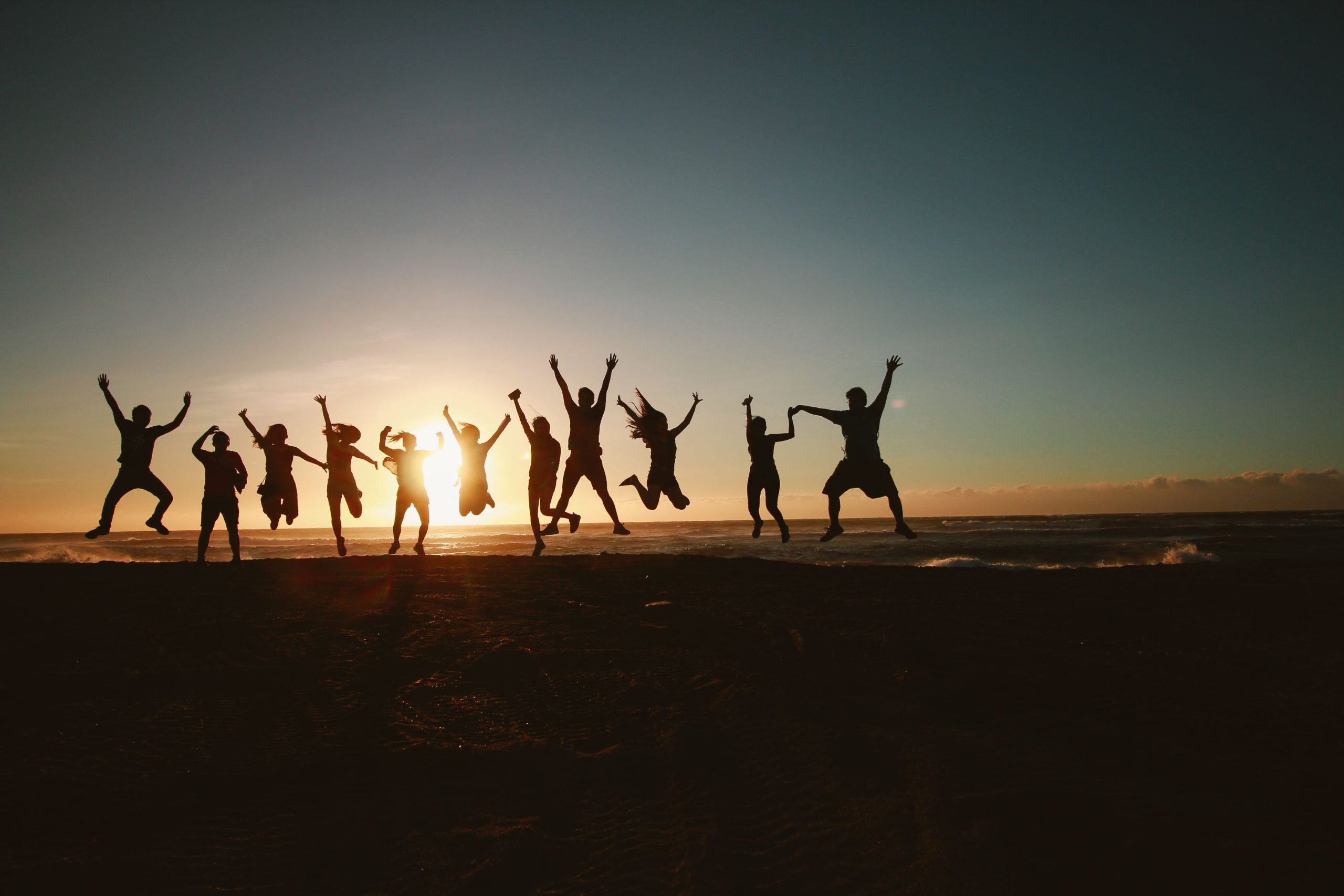 Happy people jumping in the air.