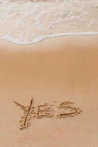 Ocean Sand with the word yes inscribed in it.
